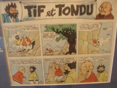 The 2 characters to the left are the Belgian BD characters Tif and Tondu (various artists and writers, 1938 -1997), a pair of private detectives.